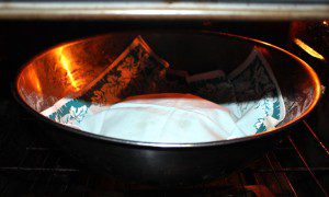 Bread in oven with light on to rise