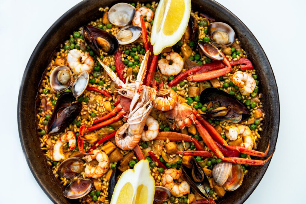 Very tasty seafood paella in the frying pan, traditional spanish food