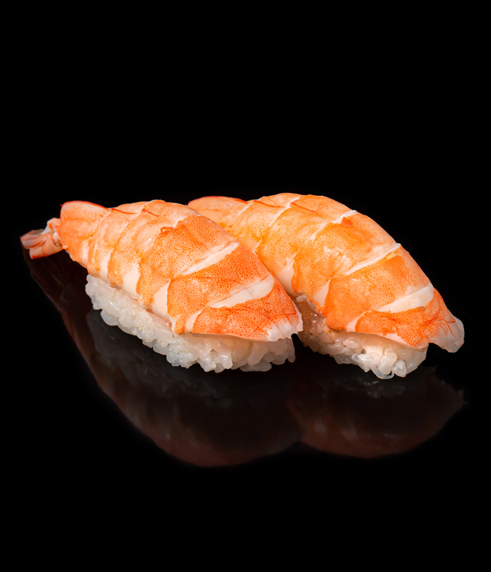 Japanese seafood sushi nigiri with shrimp on black background